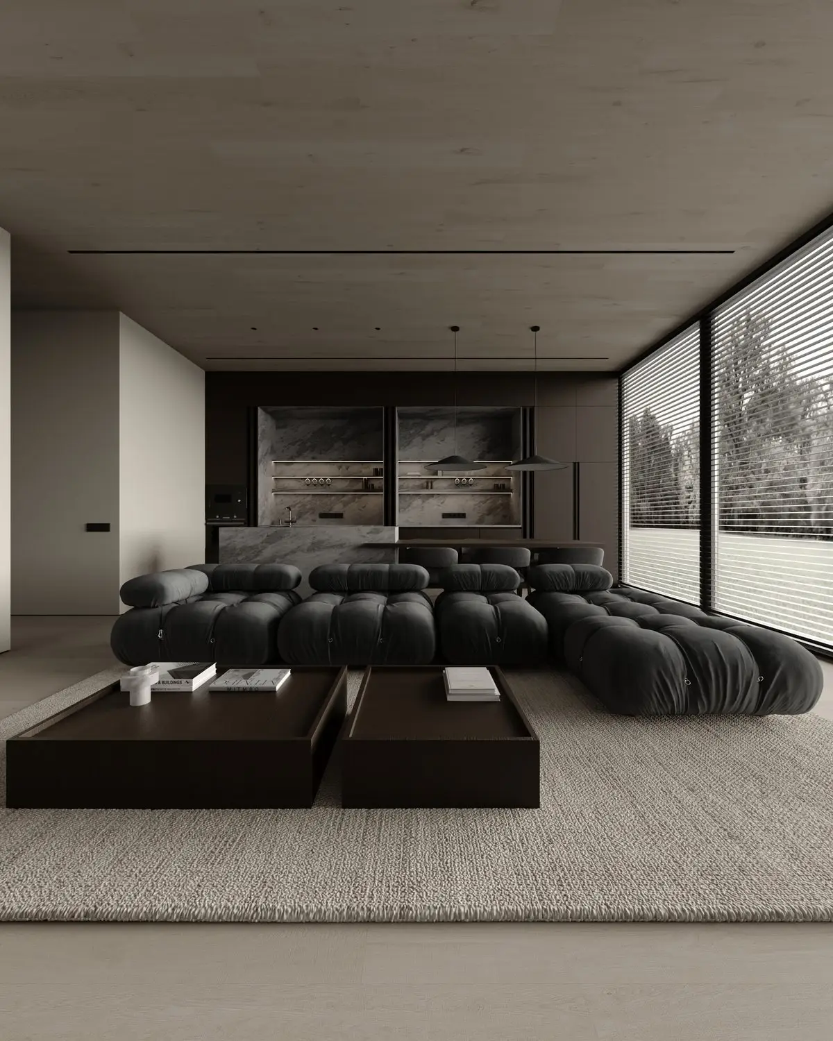 Living room in dark tones: sofa, island kitchen, and panoramic glazing